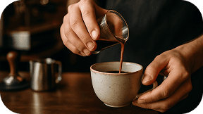 barista pouring espresso